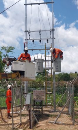 Ronco linesmen installing overhead switchgear on a distribution structure
